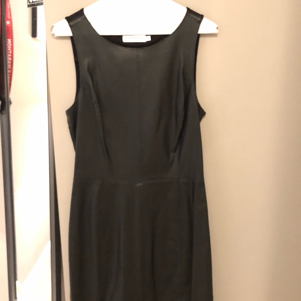 Black cocktail dress. Leather front